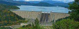 Shasta Dam, Shasta Lake, and a cloud-shrouded Mount Shasta from the Upper Sacramento Ditch Trail.