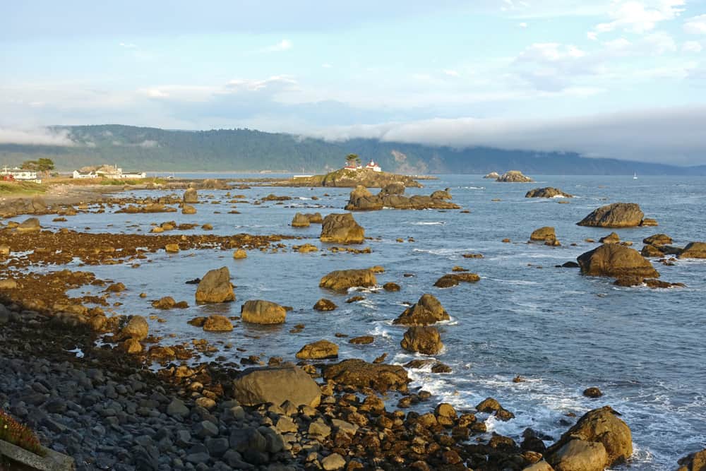 Pebble Beach Drive allows excellent views of Battery Point Lighthouse and the redwood-clad mountains stretching south of Crescent City.