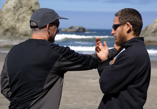 Gene Burnett and Neil Buettner doing tai chi applications on the beach at Bandon, part two